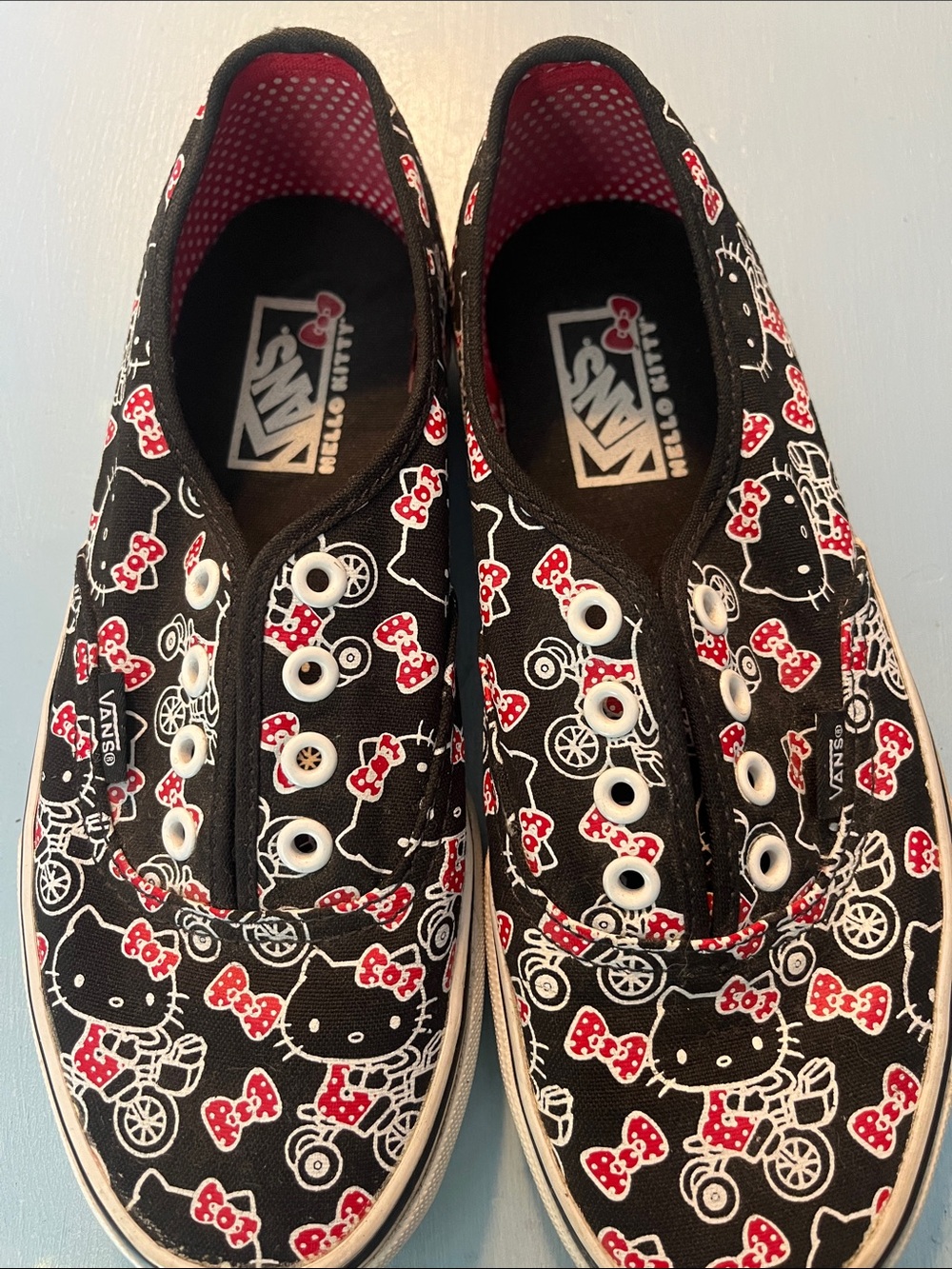 Vans Kids Black Canvas Slip-On Sneakers with Red Bow Accents